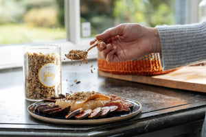 savoury granola on figs with fill baked feta