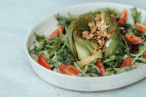 Avocado and tomatoes salad with savoury granola